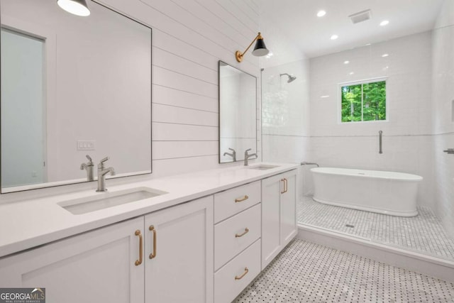 bathroom featuring vanity and separate shower and tub