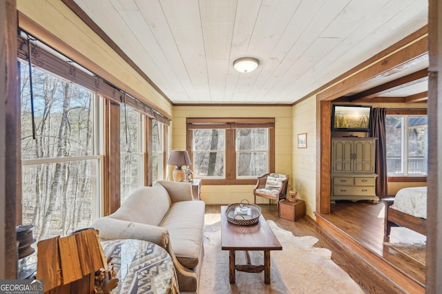 sunroom featuring wooden ceiling