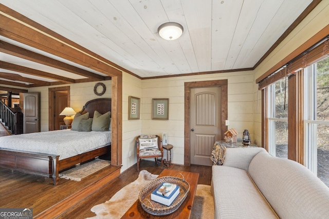 bedroom with wooden ceiling, dark hardwood / wood-style floors, and wood walls