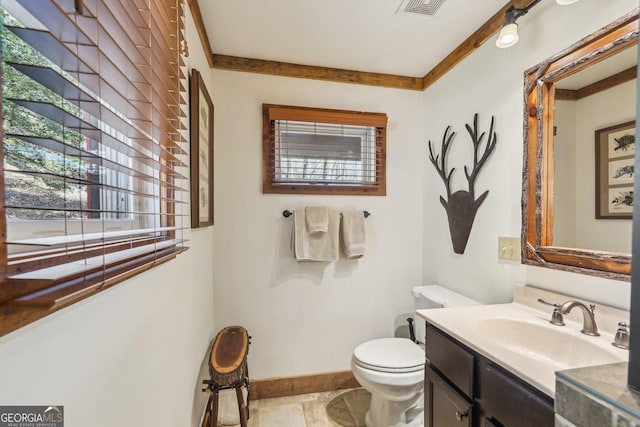 bathroom featuring vanity and toilet