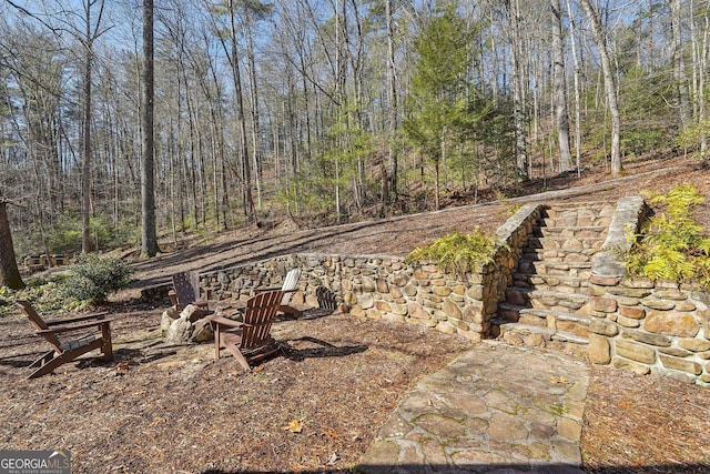 view of yard featuring a fire pit