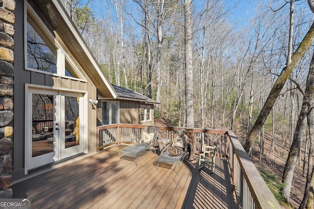 wooden deck featuring french doors