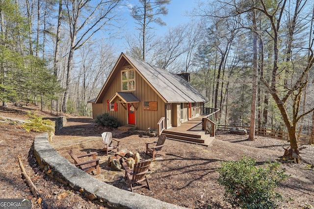 view of outbuilding featuring a fire pit