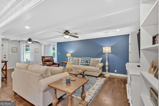 living room with beam ceiling, dark hardwood / wood-style floors, and ceiling fan