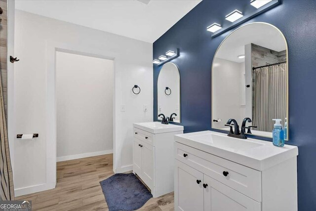 bathroom featuring hardwood / wood-style flooring and vanity