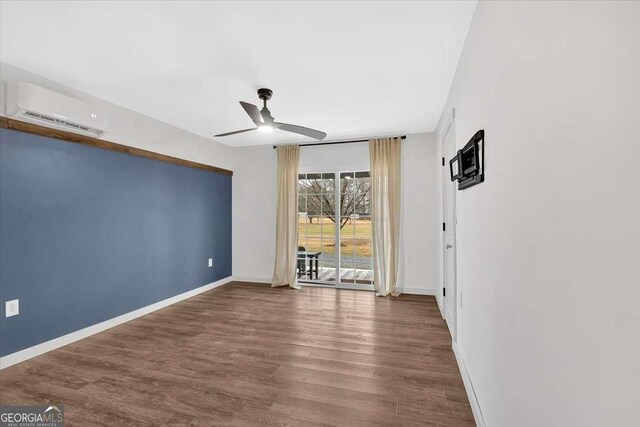 unfurnished room with dark wood-type flooring, a wall mounted AC, and ceiling fan