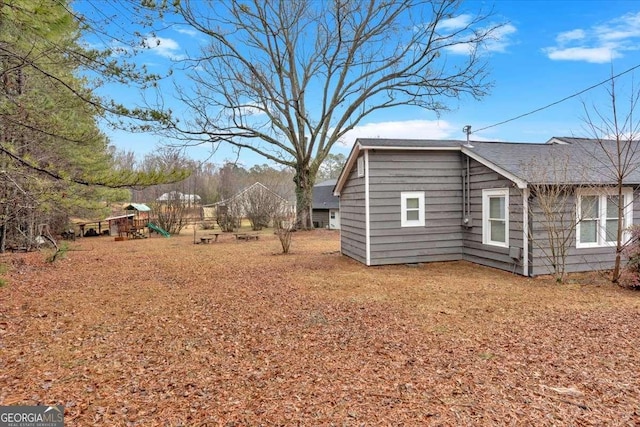 view of home's exterior with a playground