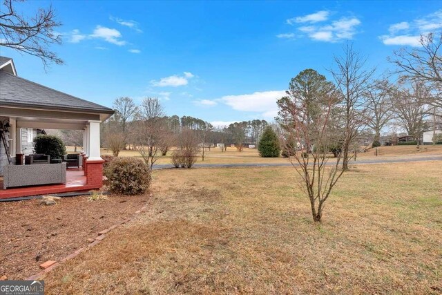 view of yard with a rural view