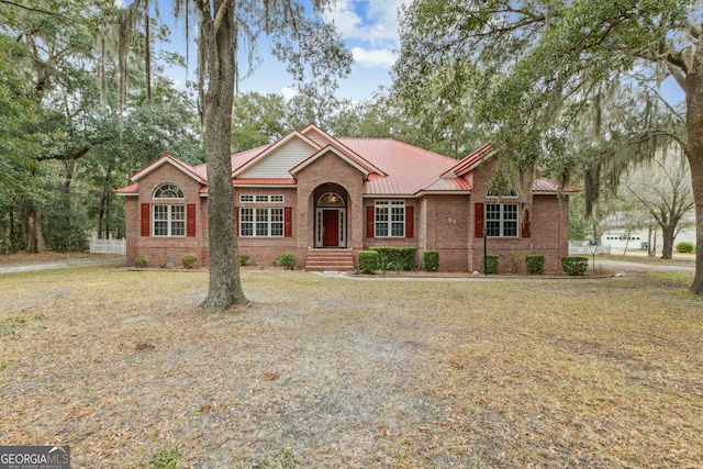 single story home featuring a front yard