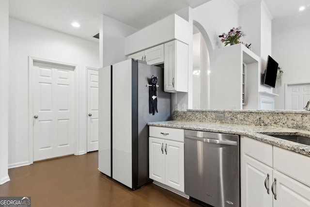 kitchen with sink, refrigerator, white cabinetry, light stone countertops, and stainless steel dishwasher