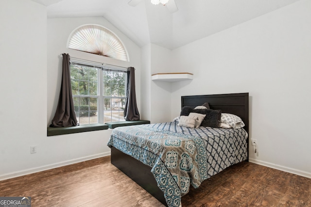 bedroom featuring ceiling fan, lofted ceiling, and dark hardwood / wood-style flooring