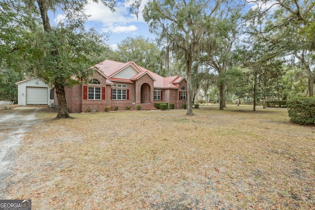 single story home with a garage and a front yard