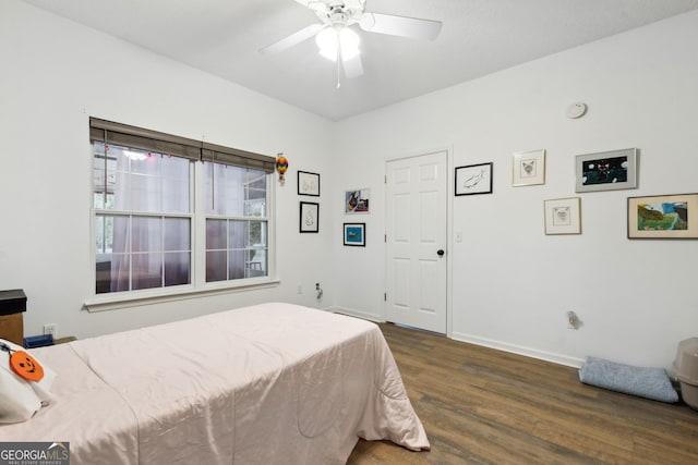 bedroom featuring dark hardwood / wood-style floors and ceiling fan