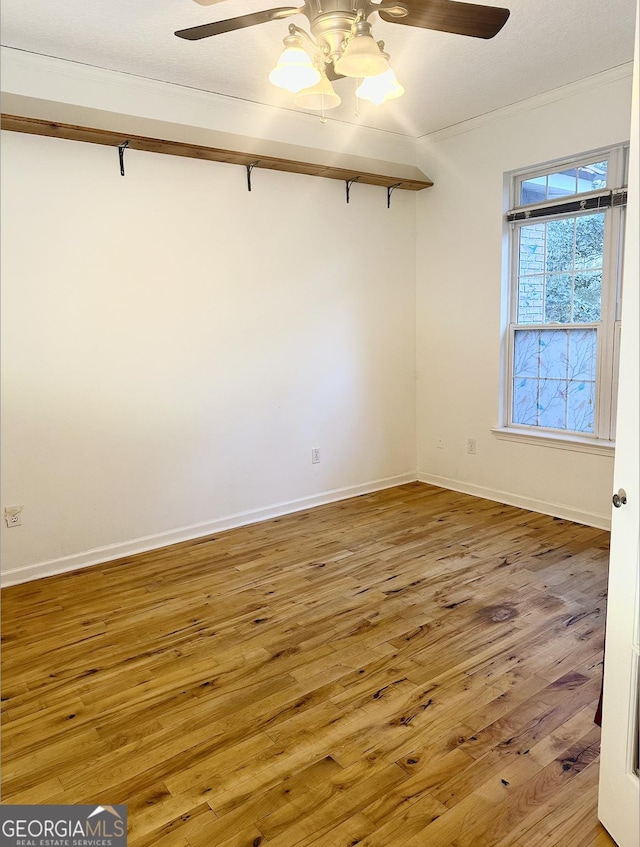 empty room featuring hardwood / wood-style floors and ceiling fan