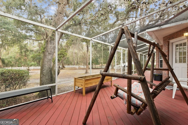 wooden deck featuring glass enclosure