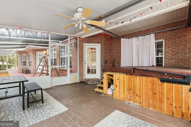 interior space featuring ceiling fan and a hot tub