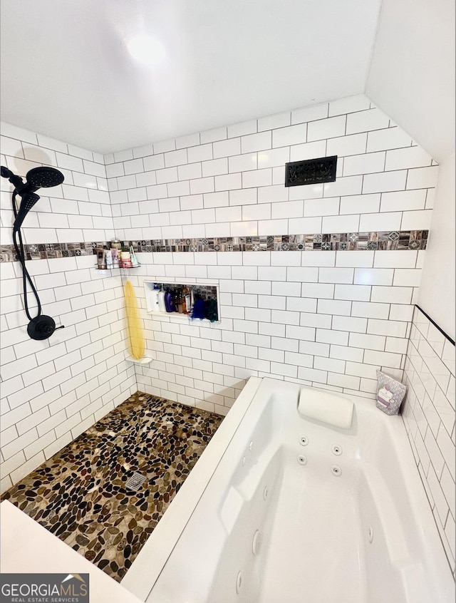 bathroom featuring plus walk in shower