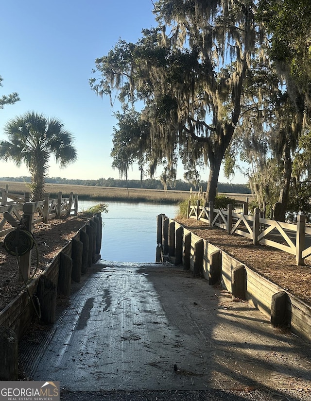 dock area featuring a water view