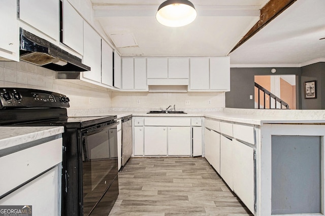 kitchen featuring white cabinetry, black / electric stove, decorative backsplash, and sink