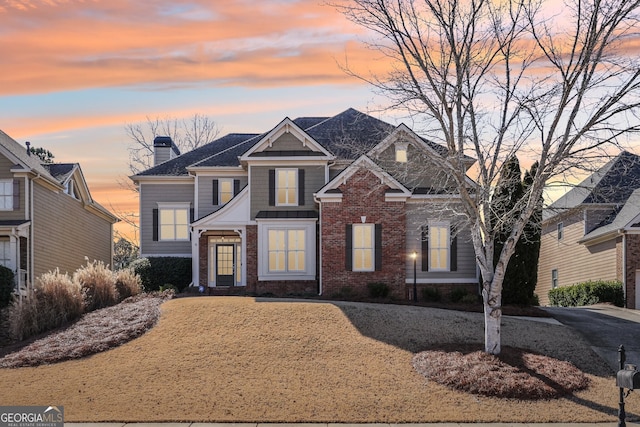 craftsman-style home with a lawn