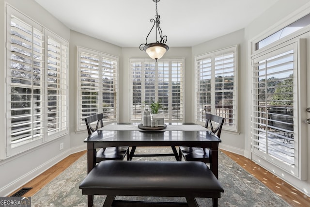 dining space featuring hardwood / wood-style flooring