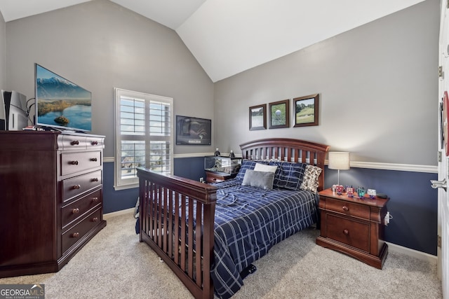 carpeted bedroom featuring lofted ceiling