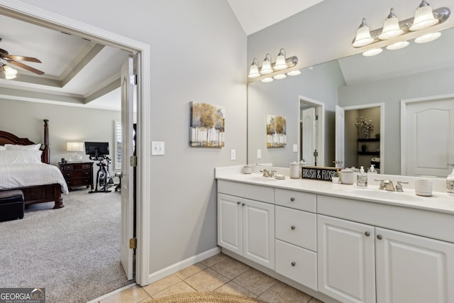 bathroom featuring vanity, tile patterned floors, a raised ceiling, and ceiling fan