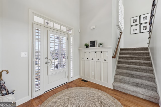 entryway with wood-type flooring