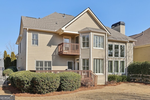 rear view of house featuring a balcony