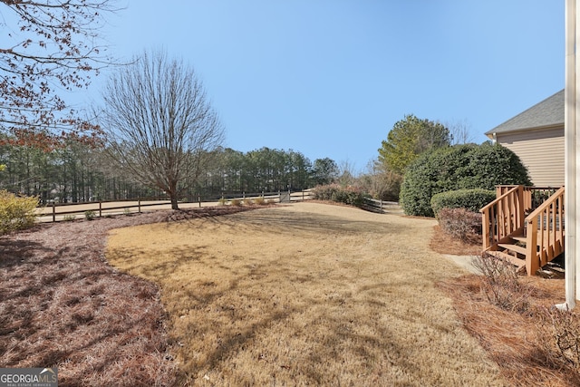 view of yard with a rural view