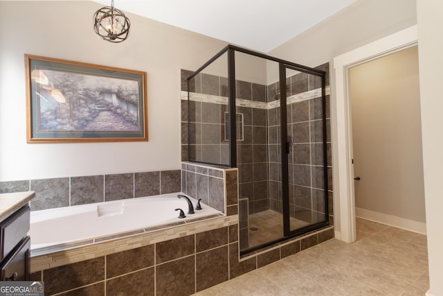 bathroom featuring vanity, shower with separate bathtub, tile patterned floors, and an inviting chandelier