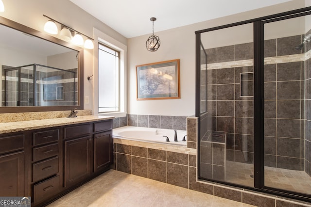 bathroom featuring vanity, tile patterned floors, and independent shower and bath