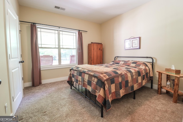 bedroom with light carpet