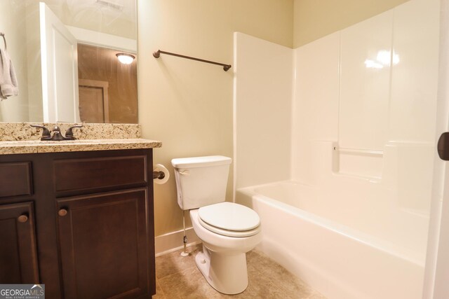 full bathroom with vanity, tile patterned flooring, shower / washtub combination, and toilet