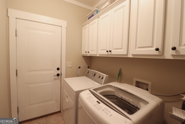 laundry area with cabinets and independent washer and dryer