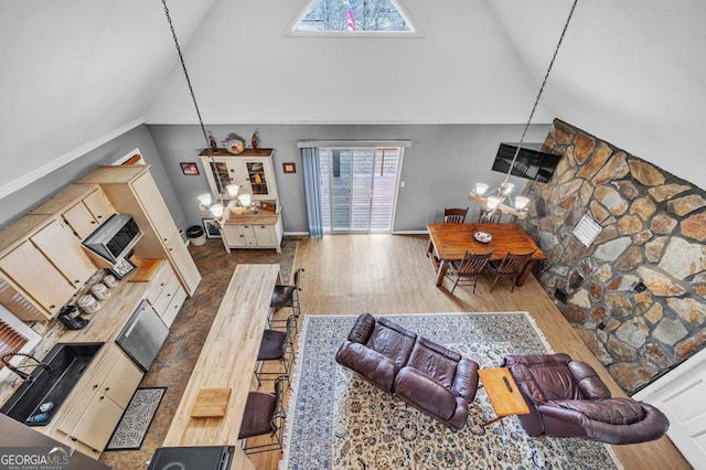 living room featuring dark wood-type flooring and high vaulted ceiling