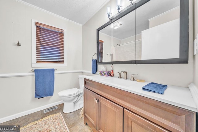 bathroom with toilet, a shower, a textured ceiling, ornamental molding, and vanity