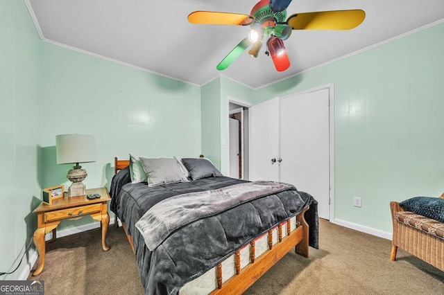 carpeted bedroom featuring ornamental molding and ceiling fan