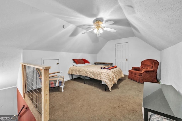 carpeted bedroom with ceiling fan, vaulted ceiling, and a textured ceiling