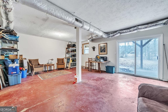 basement with a textured ceiling