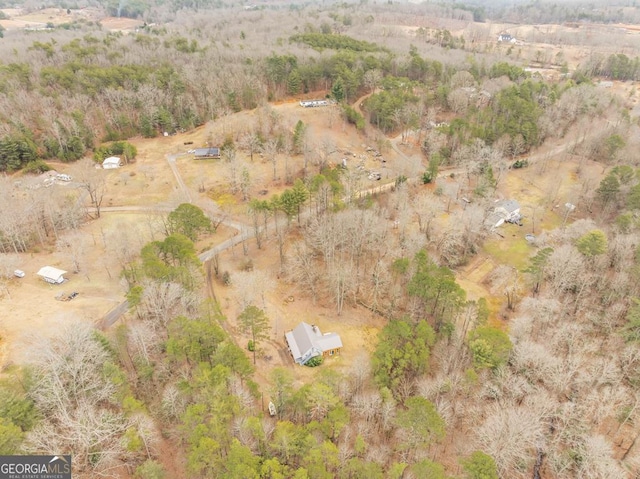 birds eye view of property with a rural view