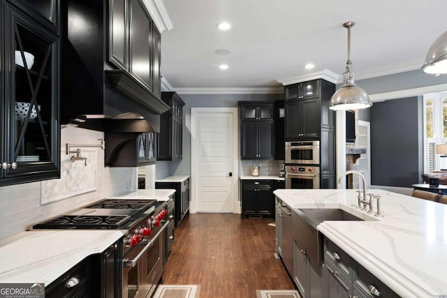 16143 Belford Dr, Alpharetta, GA 30004 - kitchen featuring stainless steel appliances, a sink, dark cabinets, backsplash, and glass insert cabinets