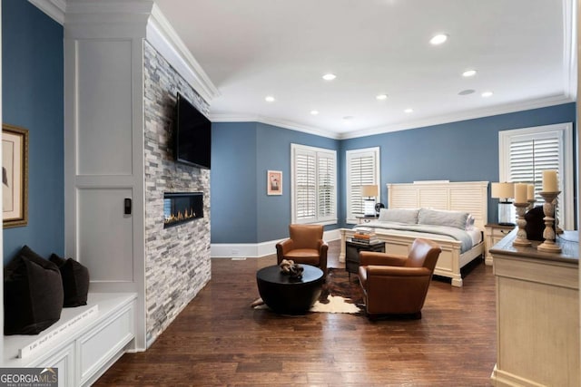 bedroom with a fireplace, ornamental molding, and dark hardwood / wood-style floors