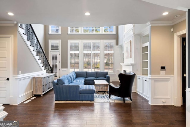 living room with ornamental molding and dark hardwood / wood-style floors