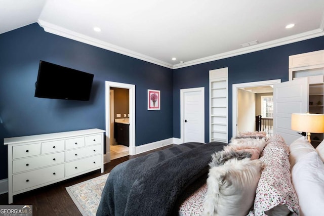 bedroom featuring lofted ceiling, ornamental molding, dark hardwood / wood-style flooring, and connected bathroom