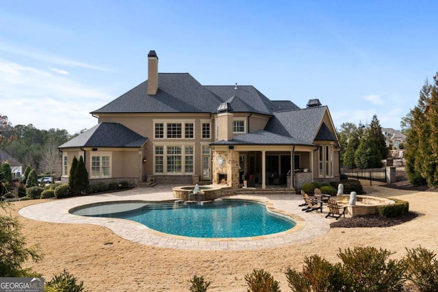 16143 Belford Dr, Alpharetta, GA 30004 - view of swimming pool with a patio, a pool with connected hot tub, and fence