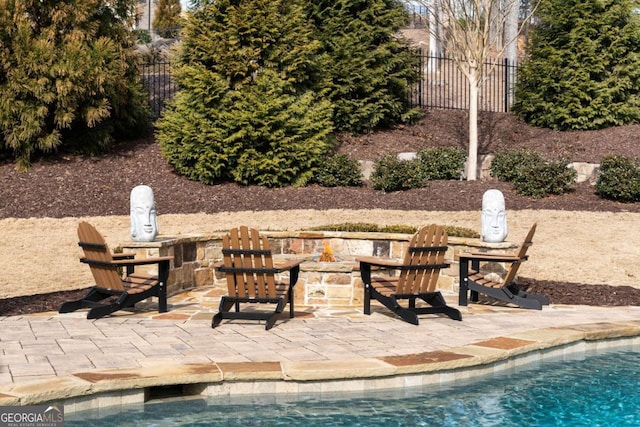 16143 Belford Dr, Alpharetta, GA 30004 - view of patio / terrace with a fire pit and fence