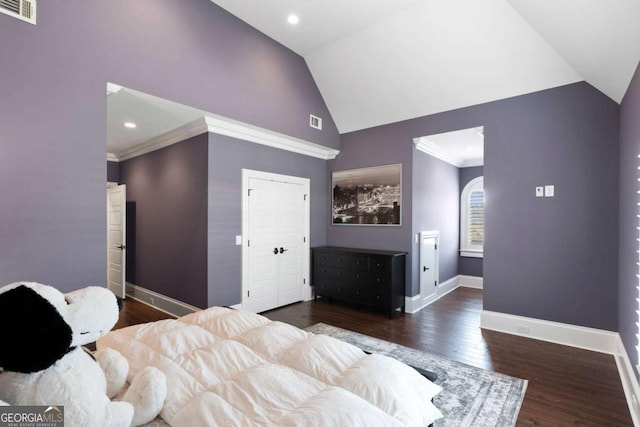 bedroom featuring crown molding, dark hardwood / wood-style floors, and high vaulted ceiling