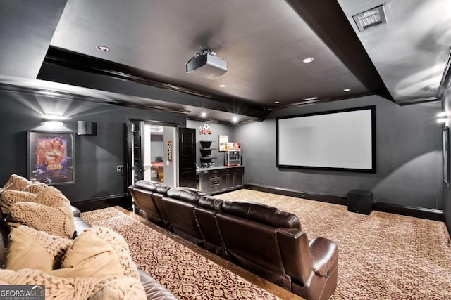 home theater room with crown molding