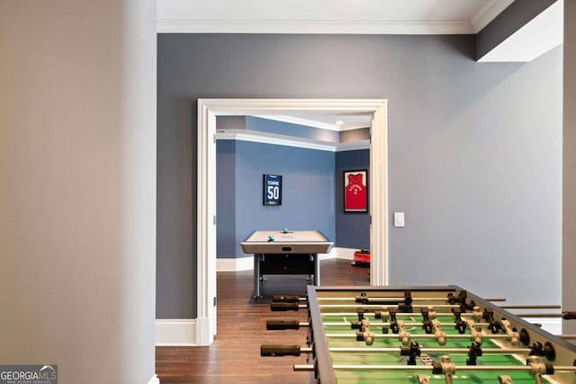 rec room featuring ornamental molding and wood-type flooring